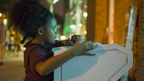 A young neighbor tries out a game.