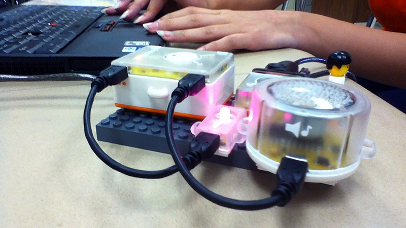 A student programs a PicoCricket.