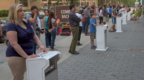 A crowd gathers as the Street Arcade kicks off. Photo courtesy Robert Banke.