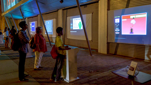 Participants playing art games at the Street Arcade, Sept 2015 (photo courtesy Robert Banke).