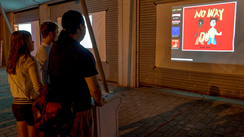 Visitors play videogames at the Street Arcade. Photo courtesy Robert Banke.