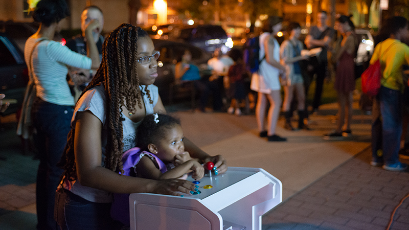 Participants playing art games at the Street Arcade, Sept 2015 (photo courtesy Robert Banke).